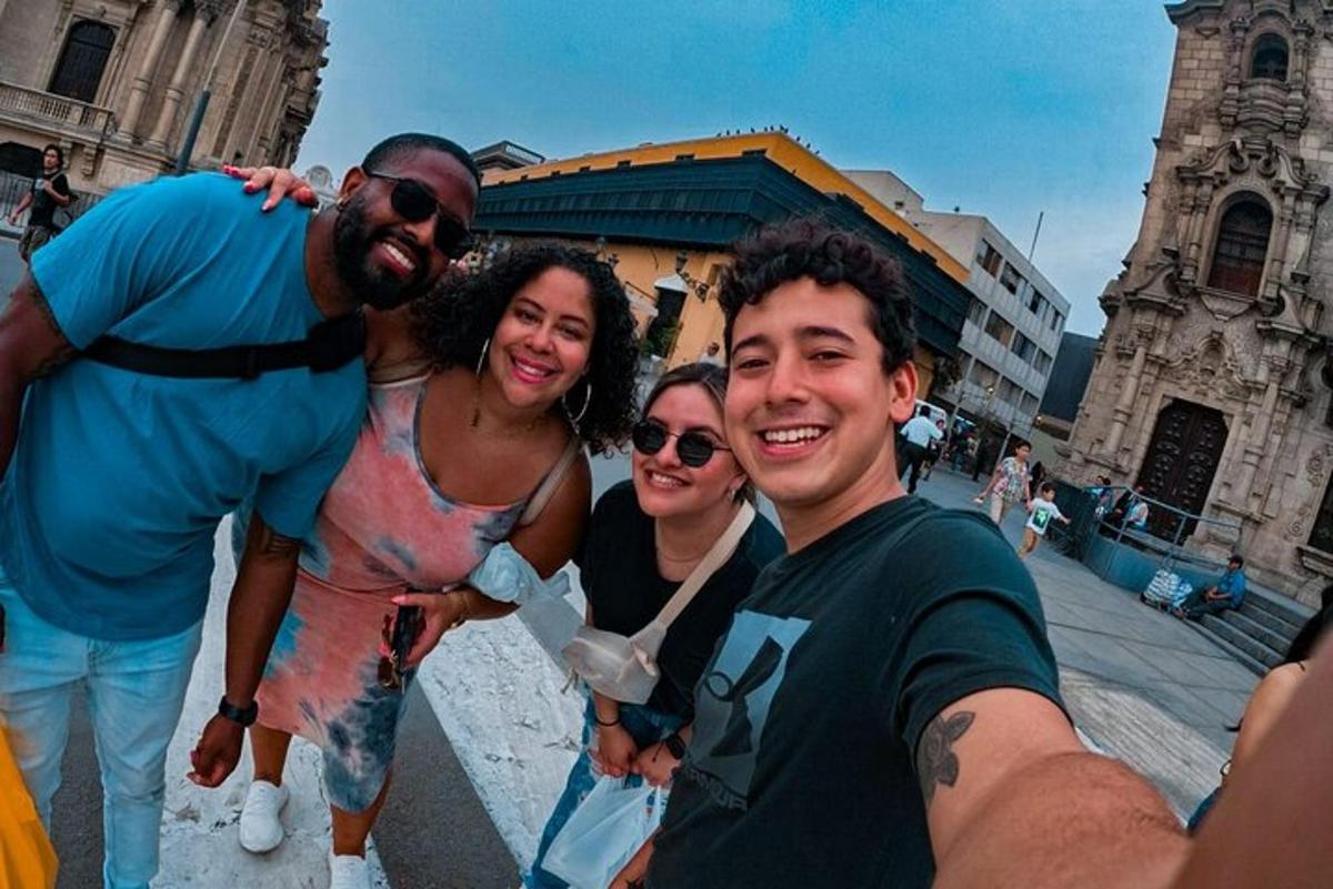a group of people posing for a picture in front of a church