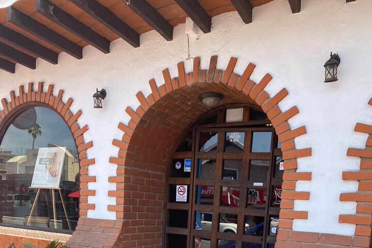 a brick building with two arched windows and a door