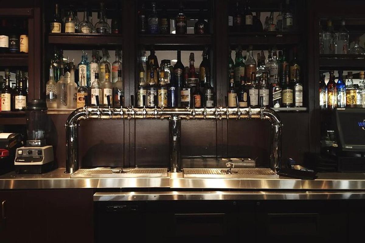 a bar with a lot of bottles of alcohol