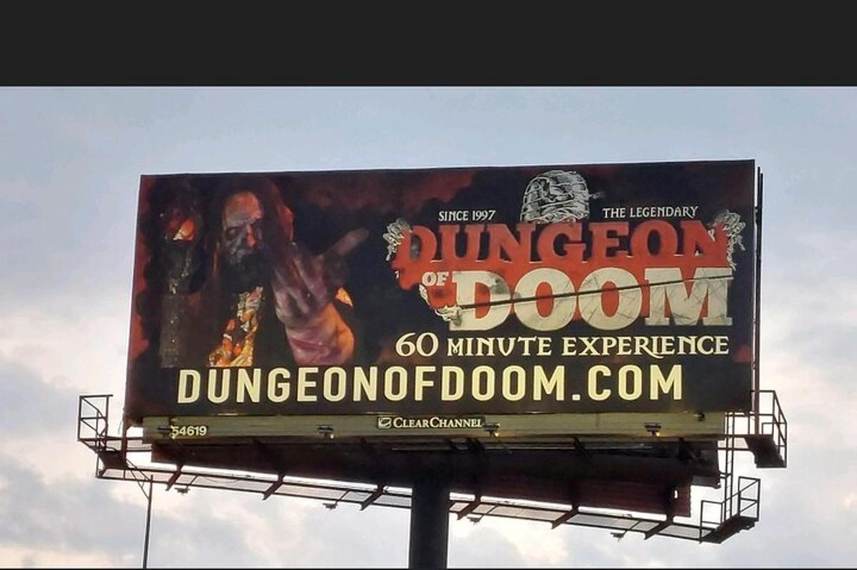 a billboard sign for the dungeon of the doom