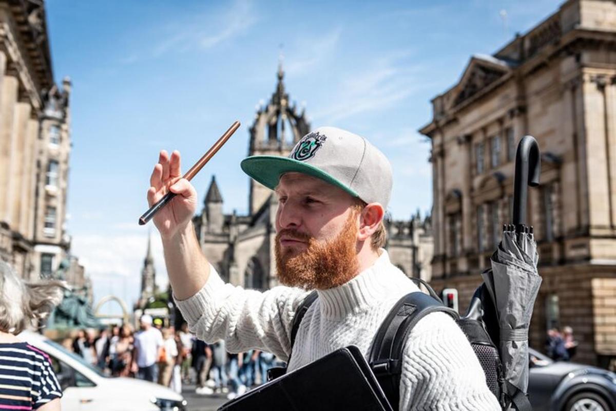 a man with a beard holding a pair of chopsticks