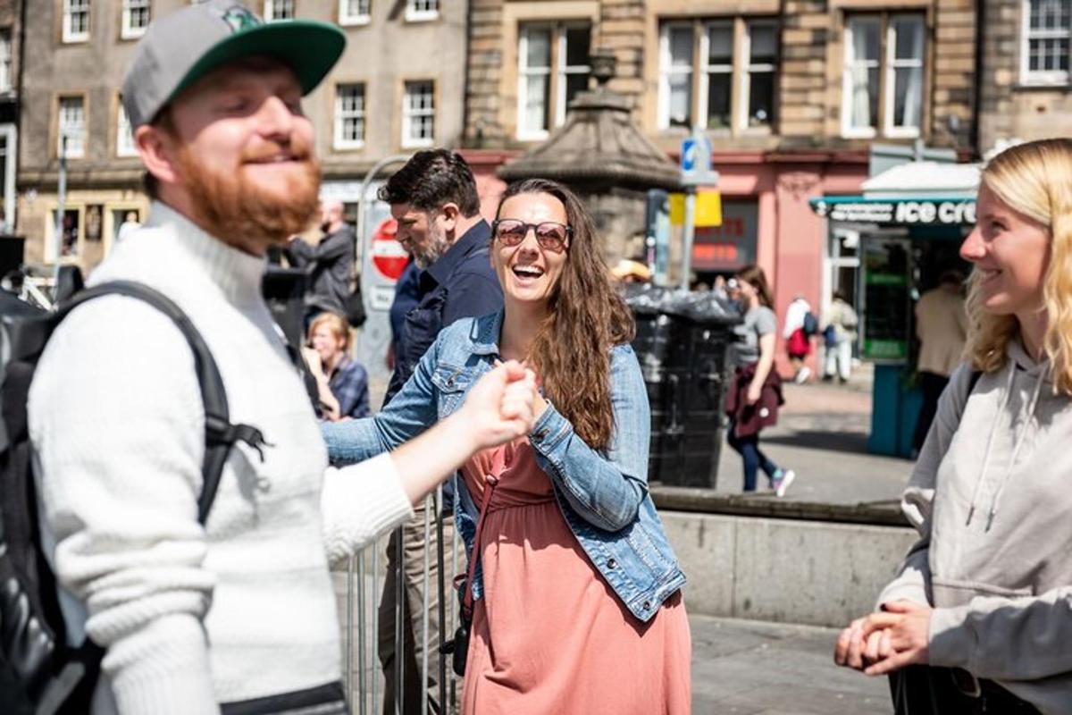 a woman is shaking hands with a man on the street