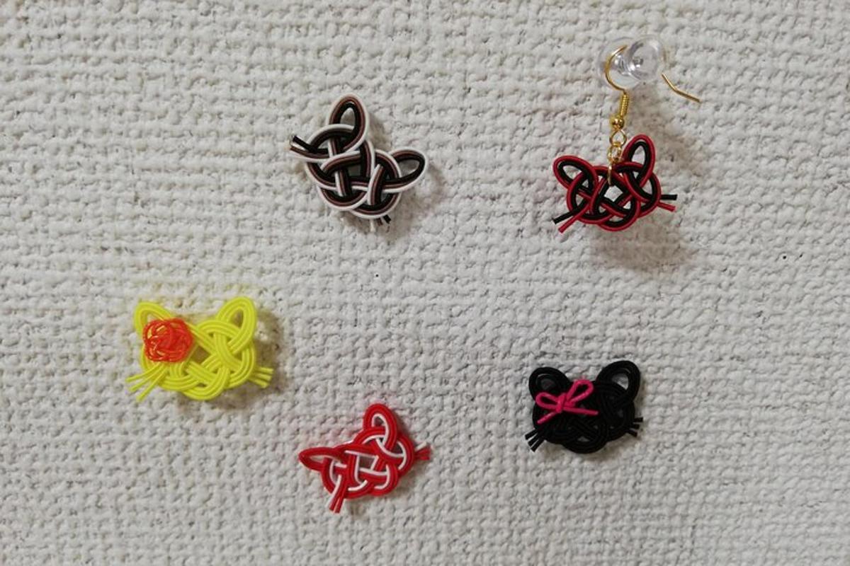 a group ofadedaded earrings on a white surface