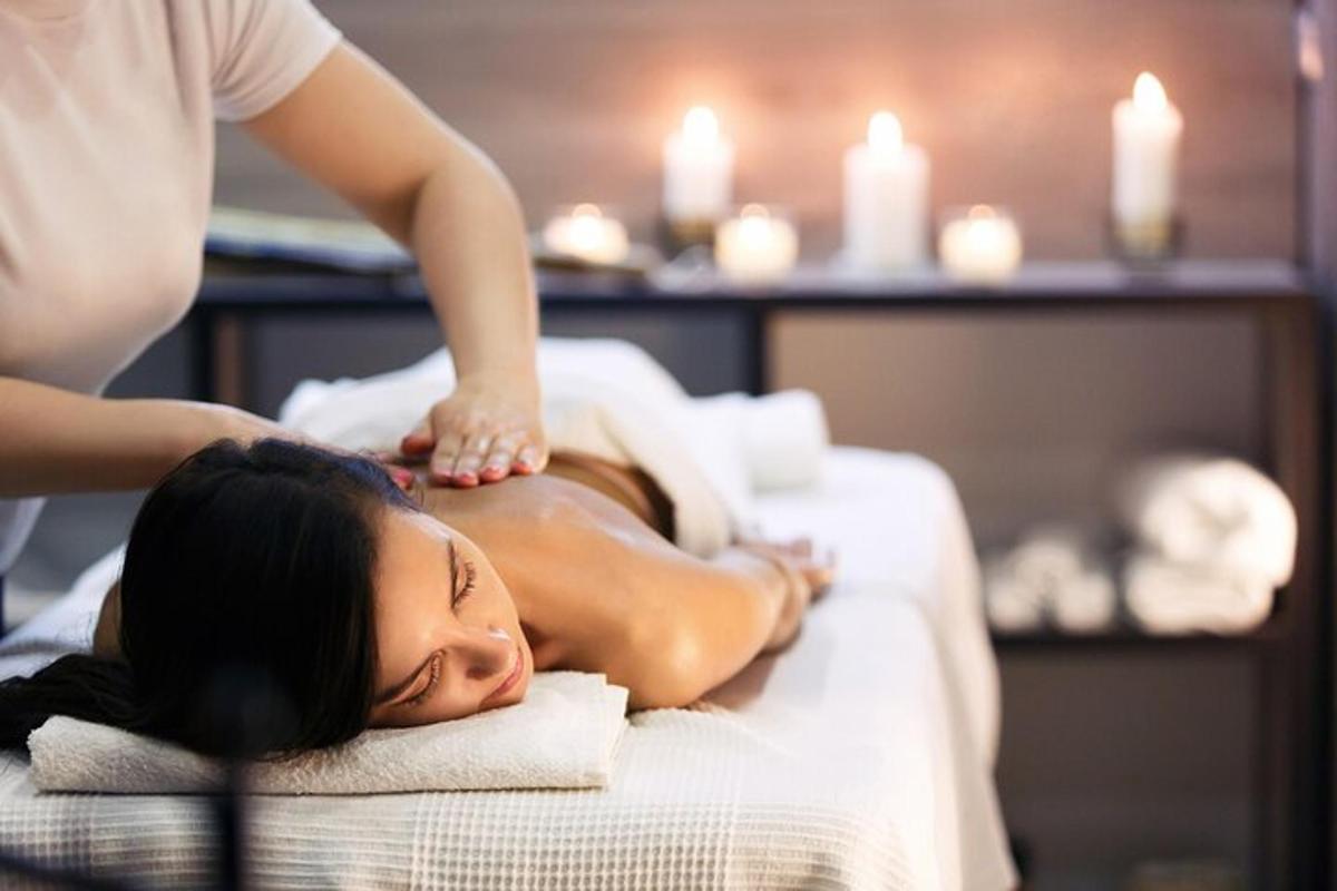 a woman getting a back massage at a spa