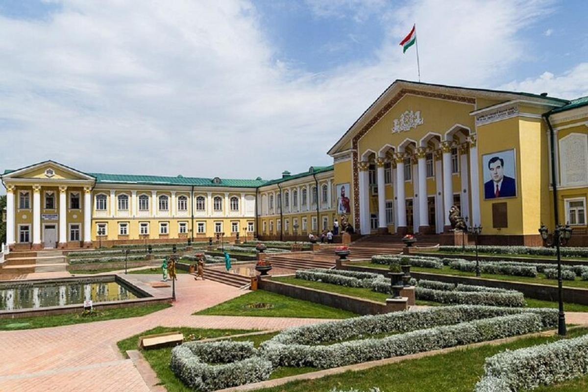 a large building with a garden in front of it