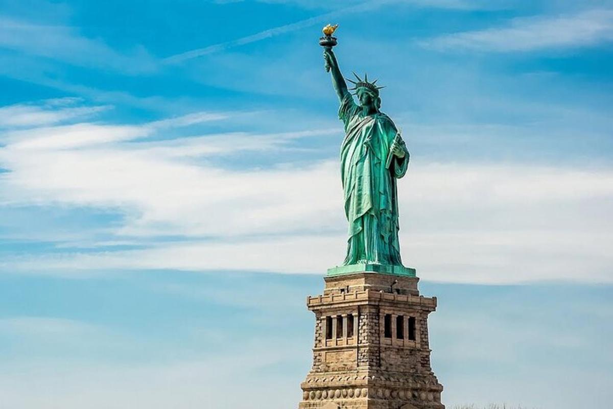 the statue of liberty with a blue sky in the background