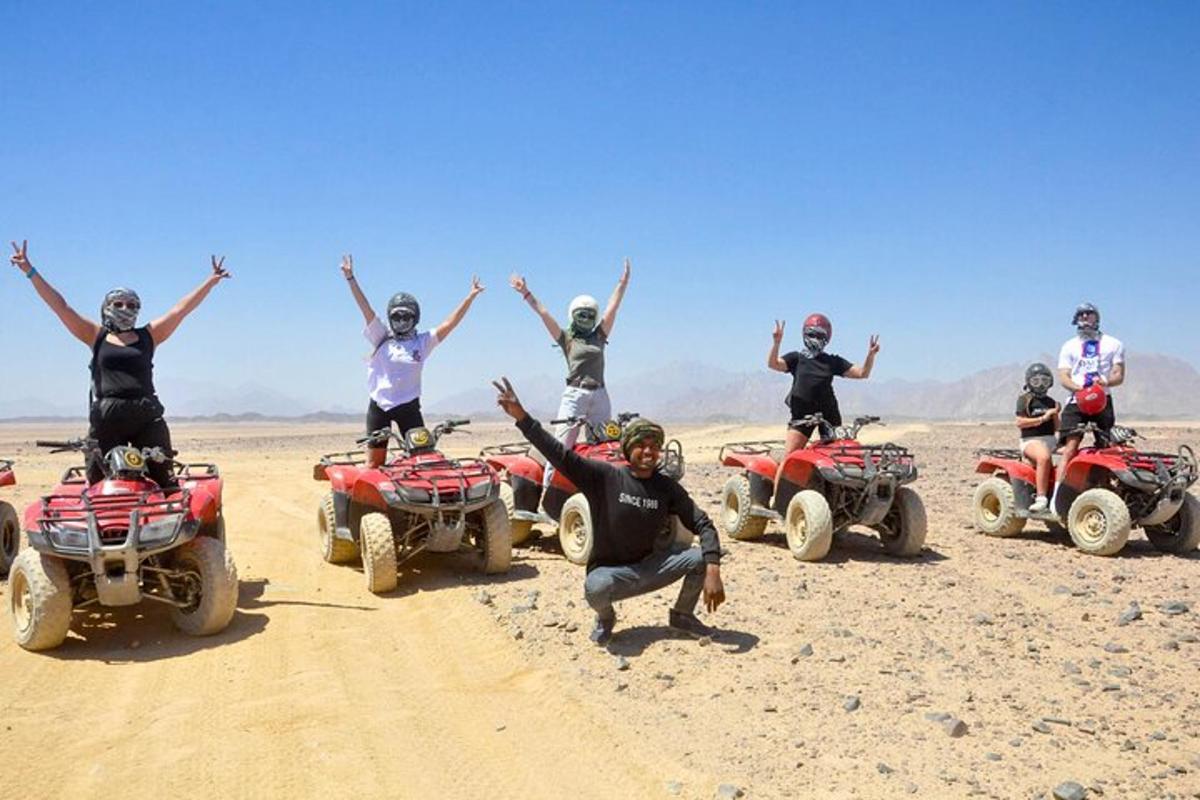 a group of people on atvs in the desert