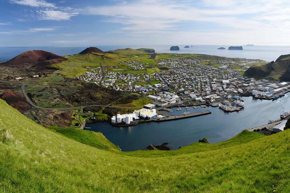 an aerial view of a small harbor on a hill