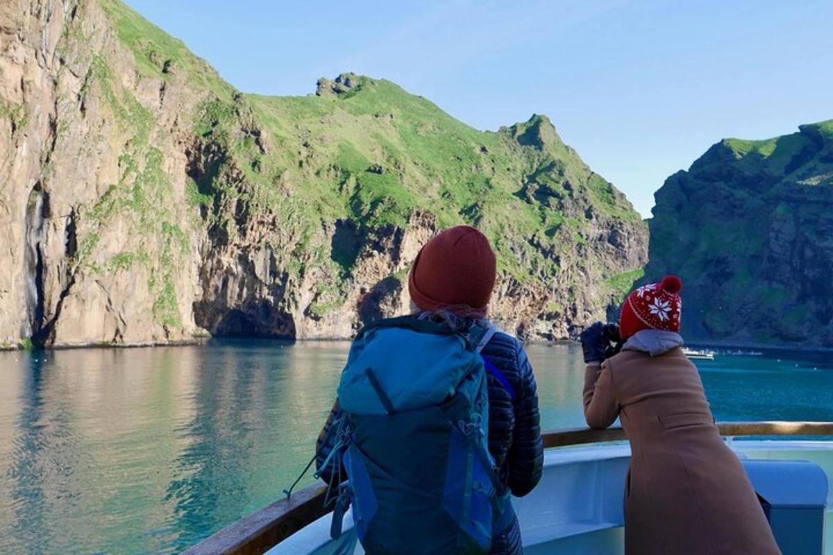 two people on a boat looking at the water