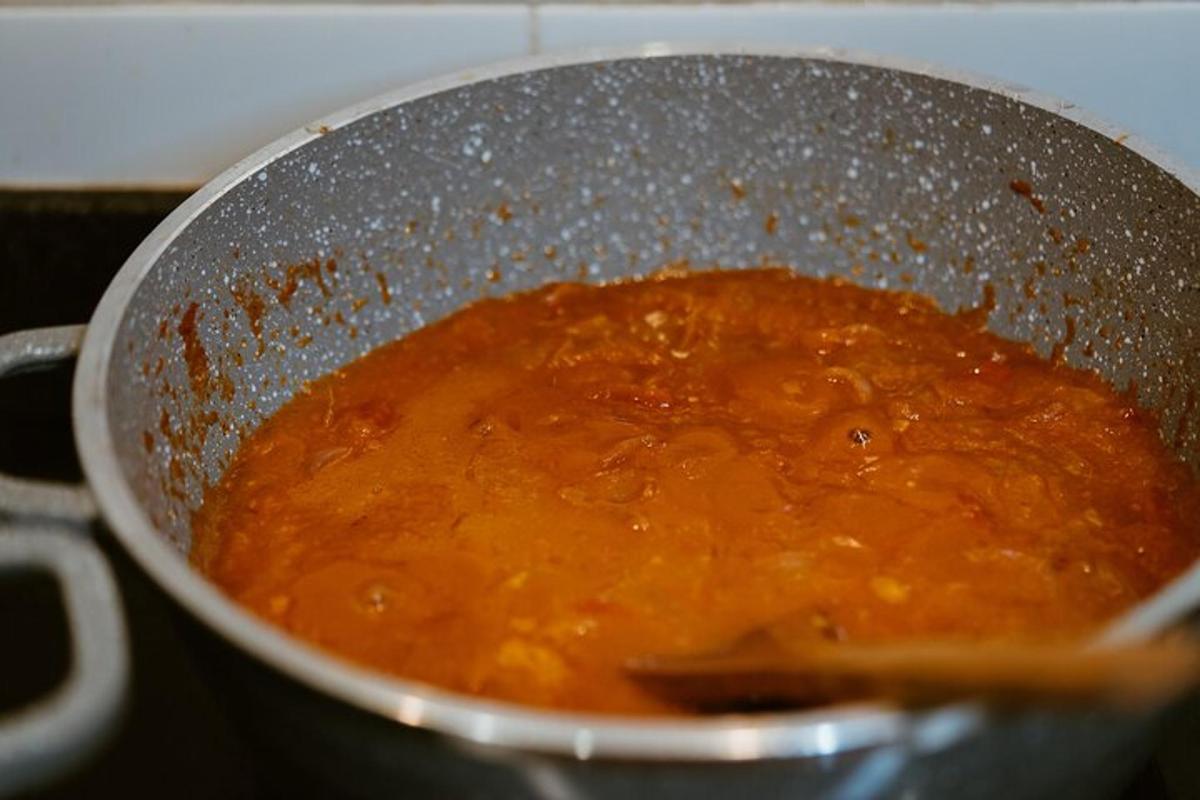 a pot filled with a soup on a stove