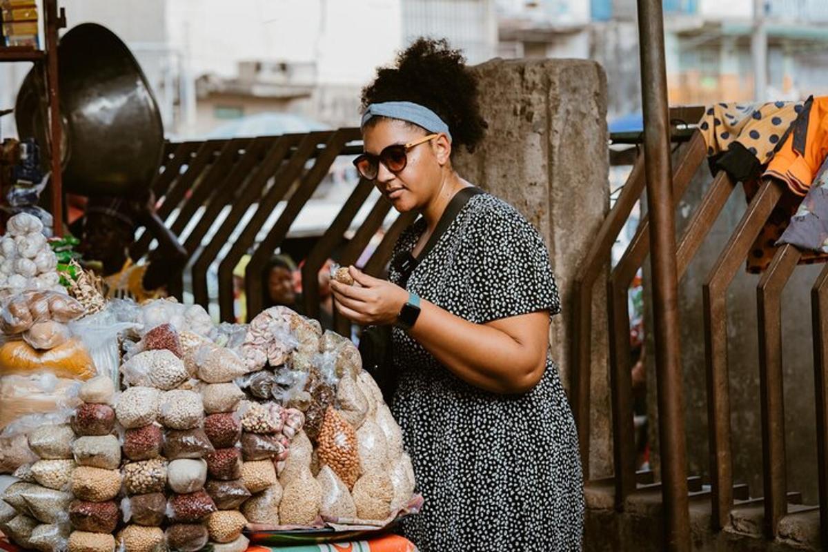a woman standing next to a pile of stuffed animals