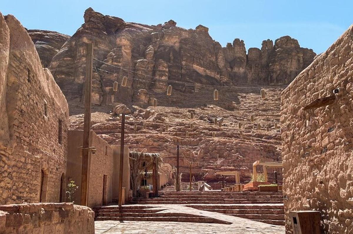 an alley with a mountain in the background