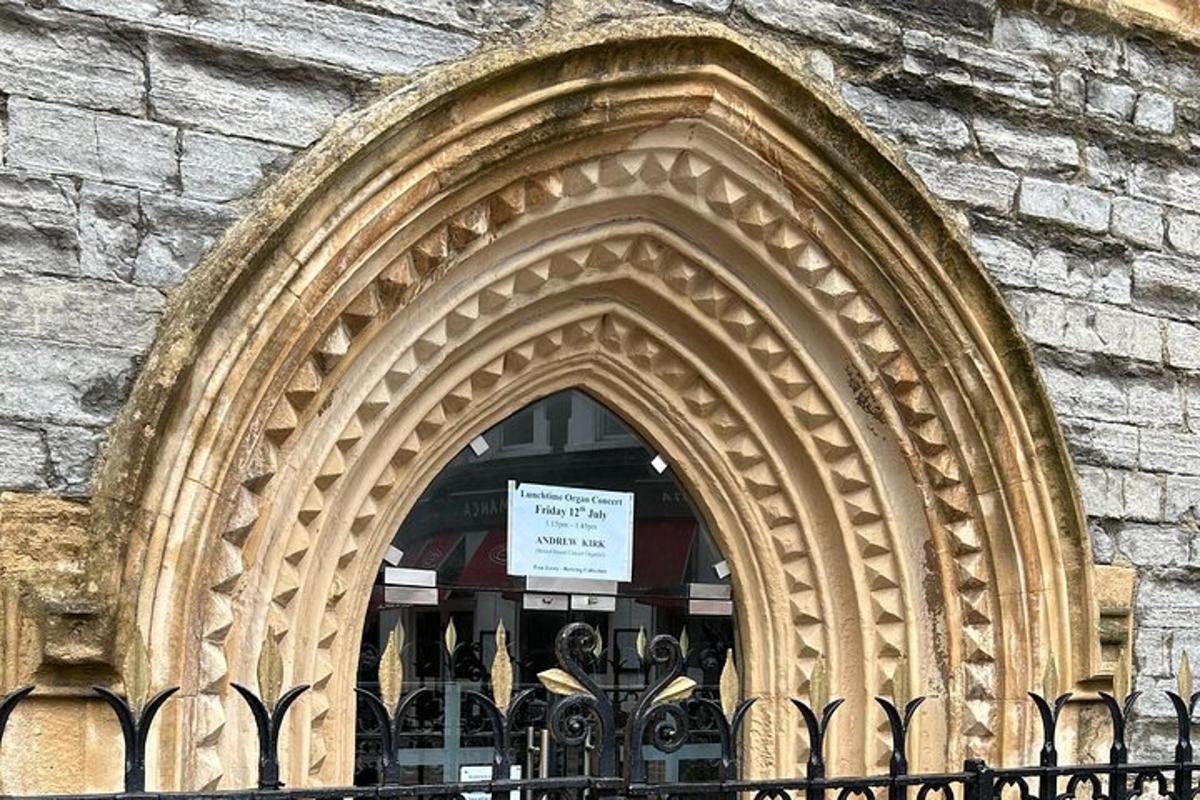 an arched window of a building with a sign in it