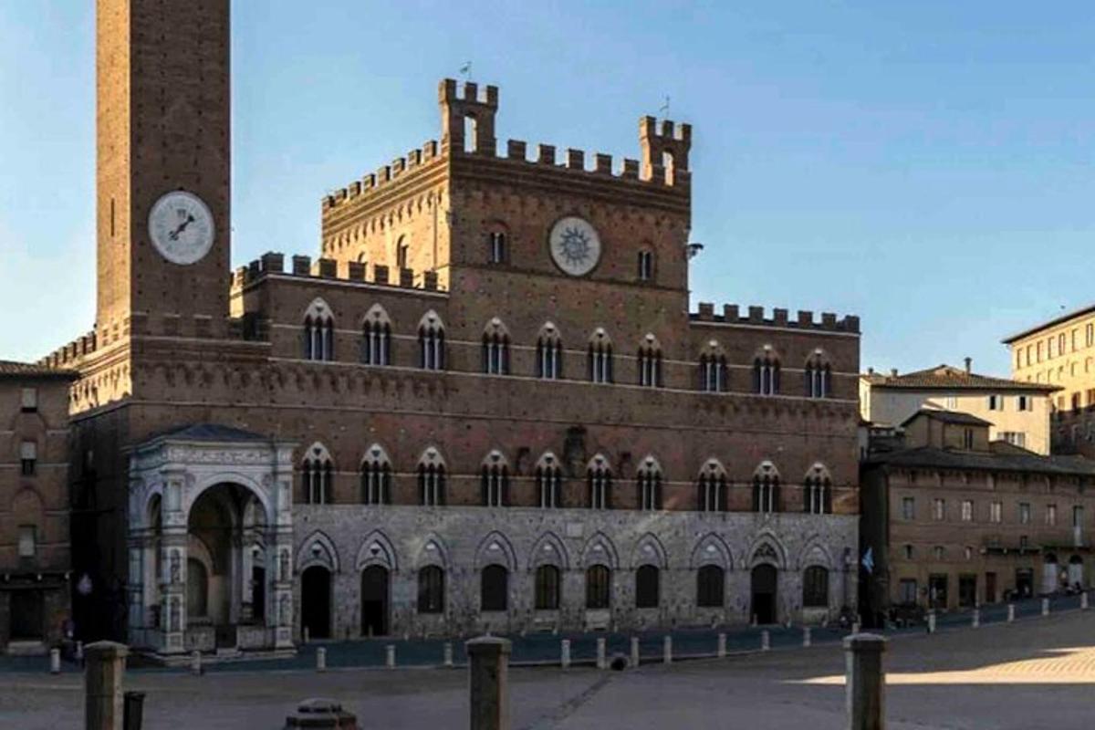 a large brick building with a clock tower