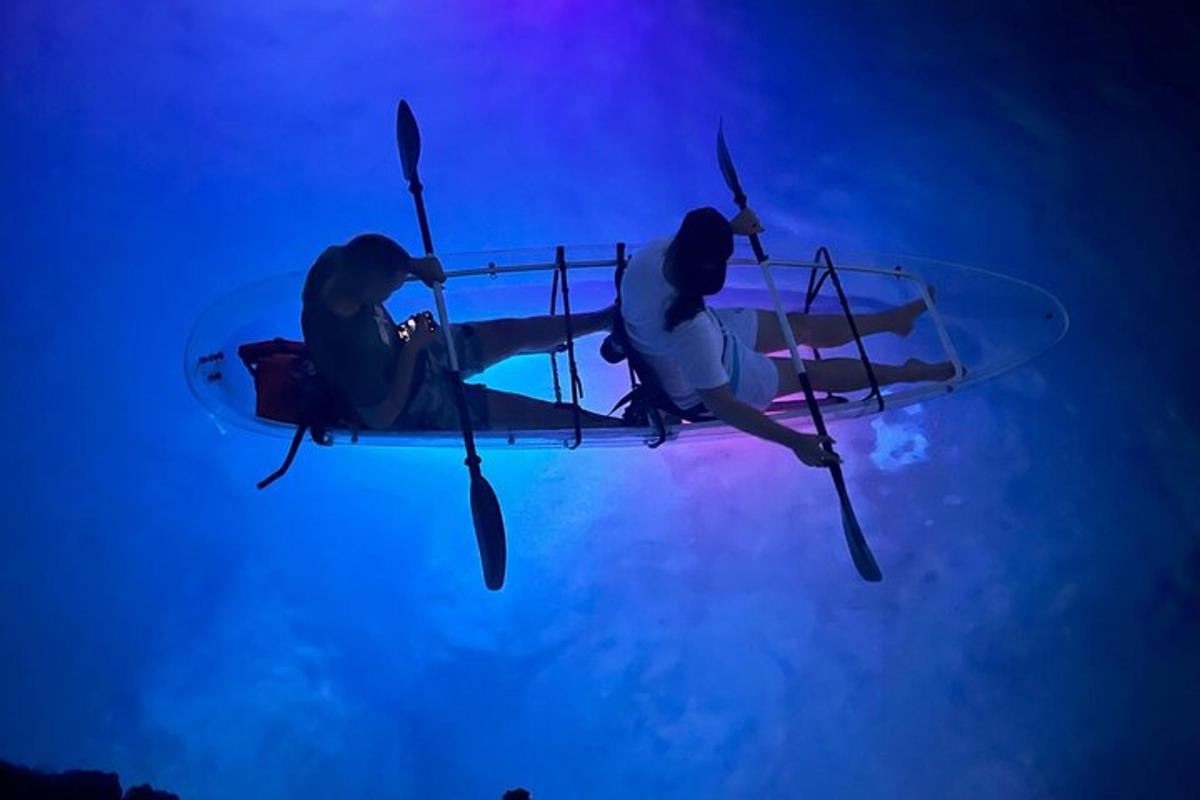 two people on a biplane flying in the sky