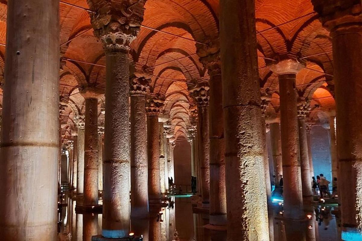 a row of columns in a large building with domed ceilings