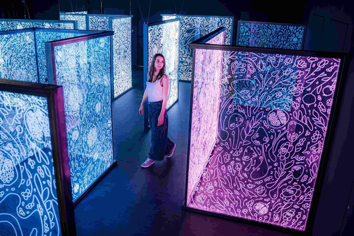 a woman standing in front of three doors