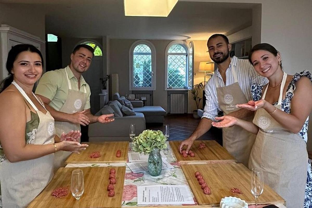 a group of people standing around a table with food