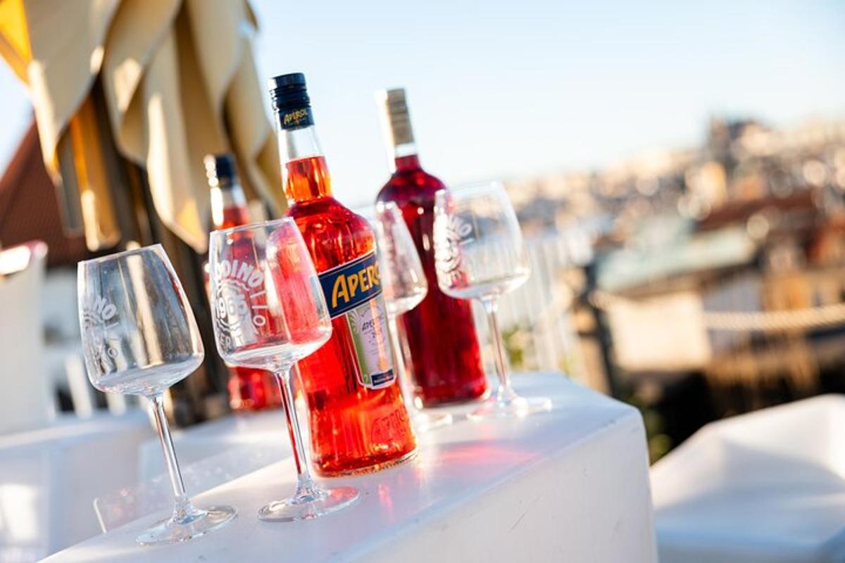 a group of wine bottles and glasses on a table