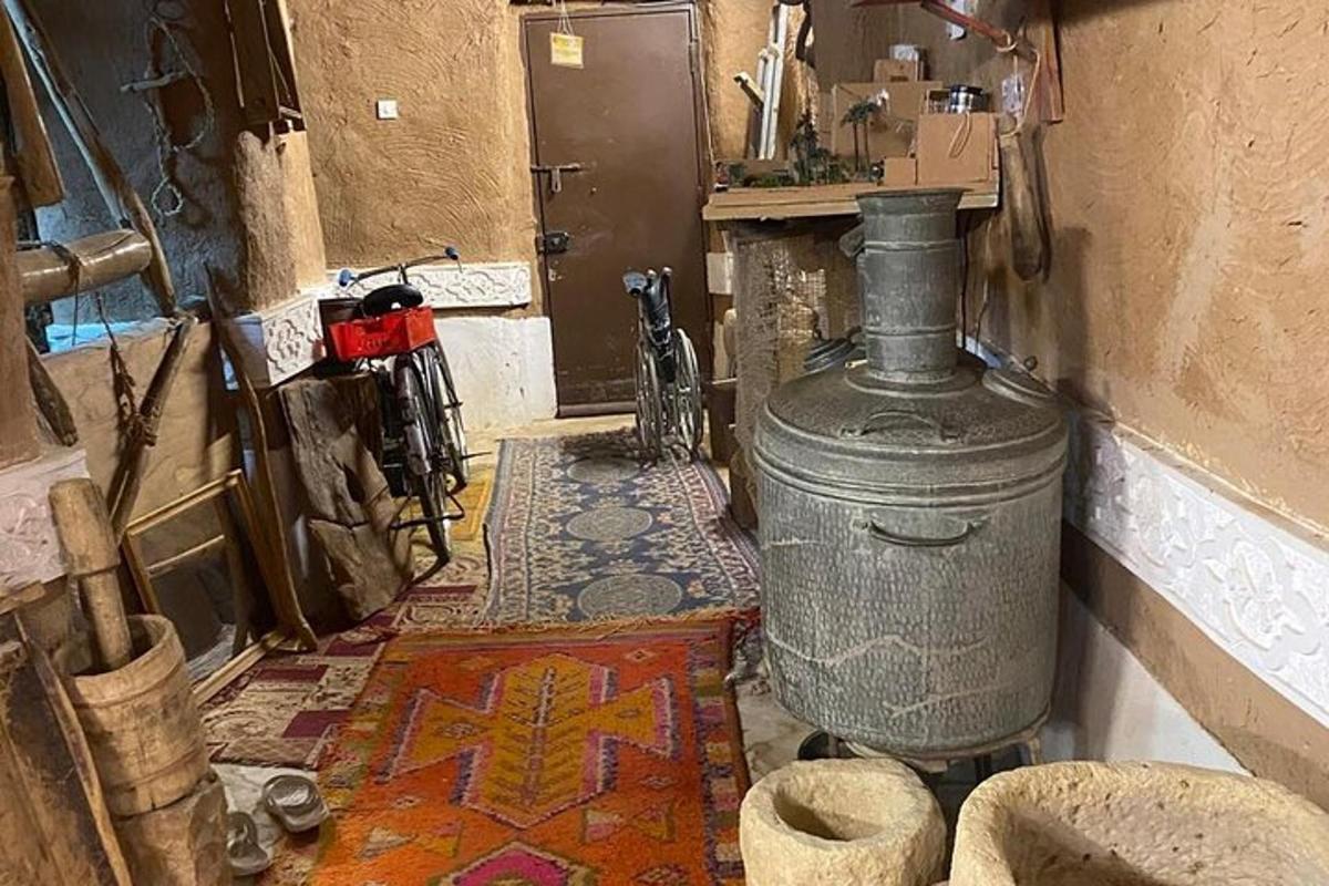 a room with a stove and a floor with a rug