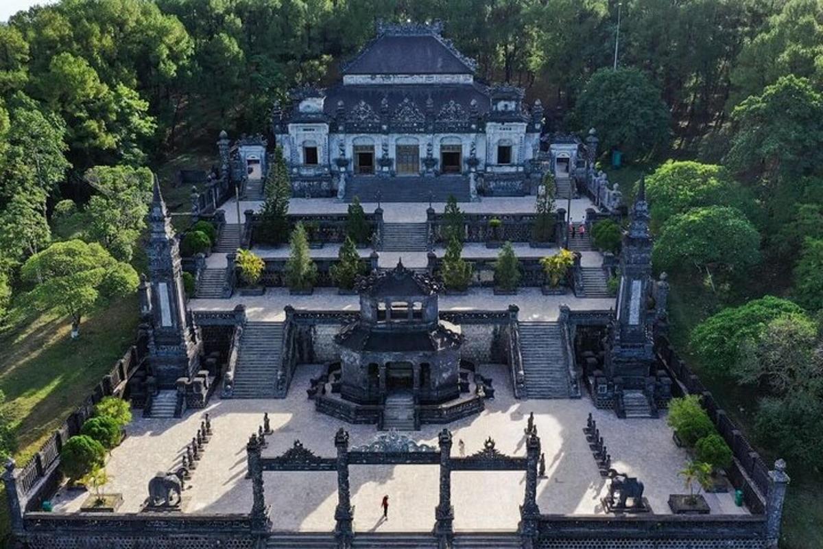 an aerial view of a large building in a park