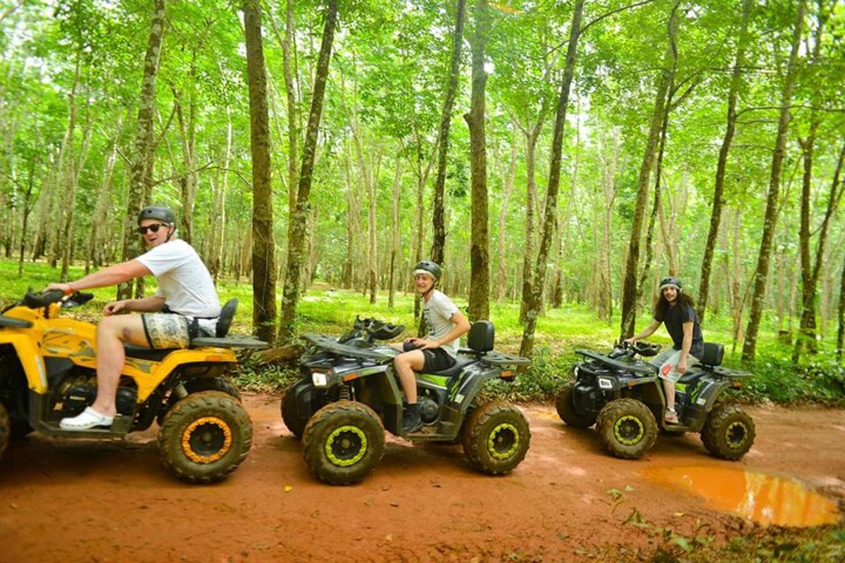 a group of people riding atvs on a dirt road