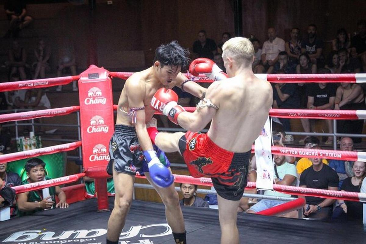 two young men are boxing in a boxing match