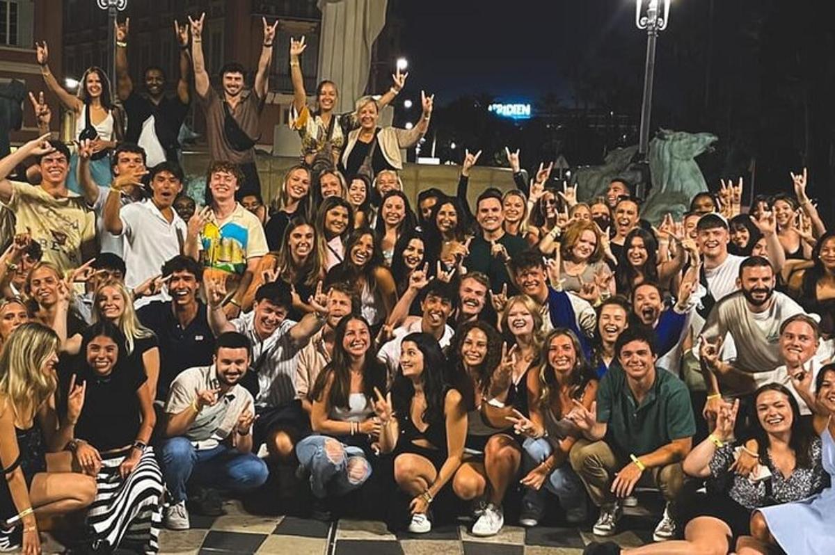 a large group of people posing for a picture
