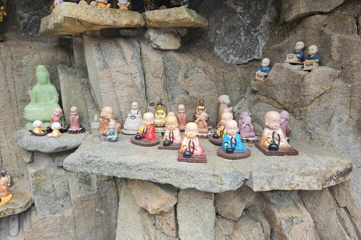 a bunch of figurines sitting on a rock