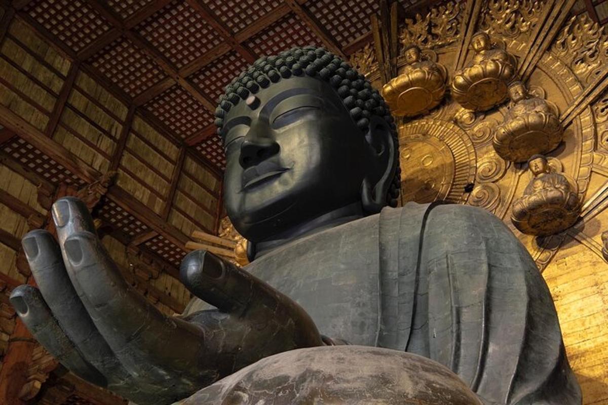 a large statue in a room with a ceiling