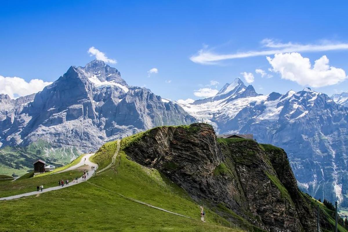 a group of people walking up a mountain