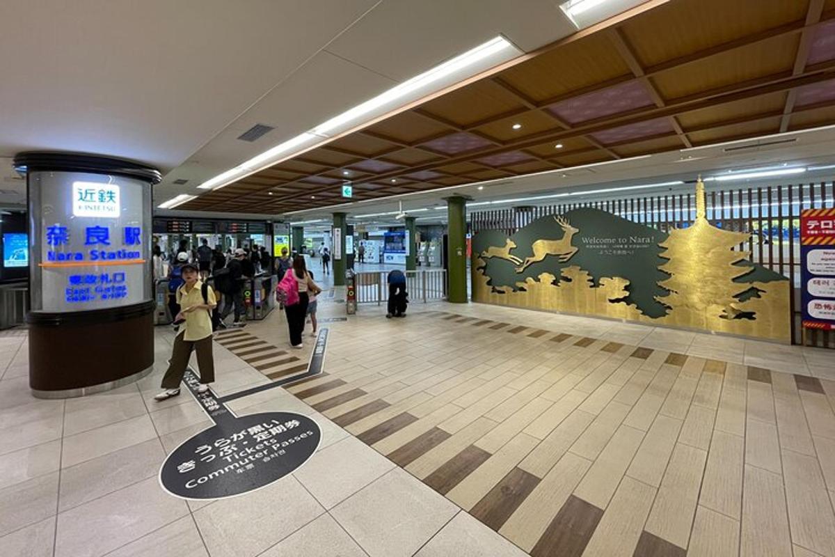 a hallway of an airport with people walking through a hallway