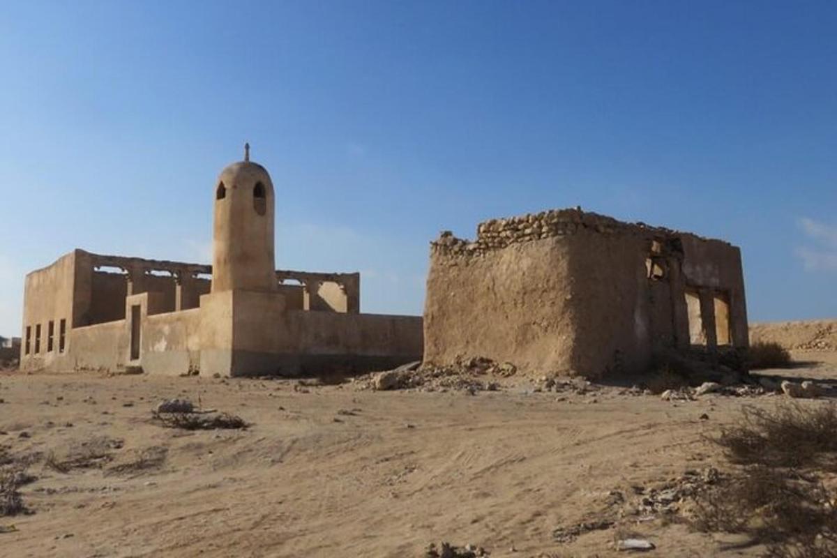 an old building in the middle of the desert