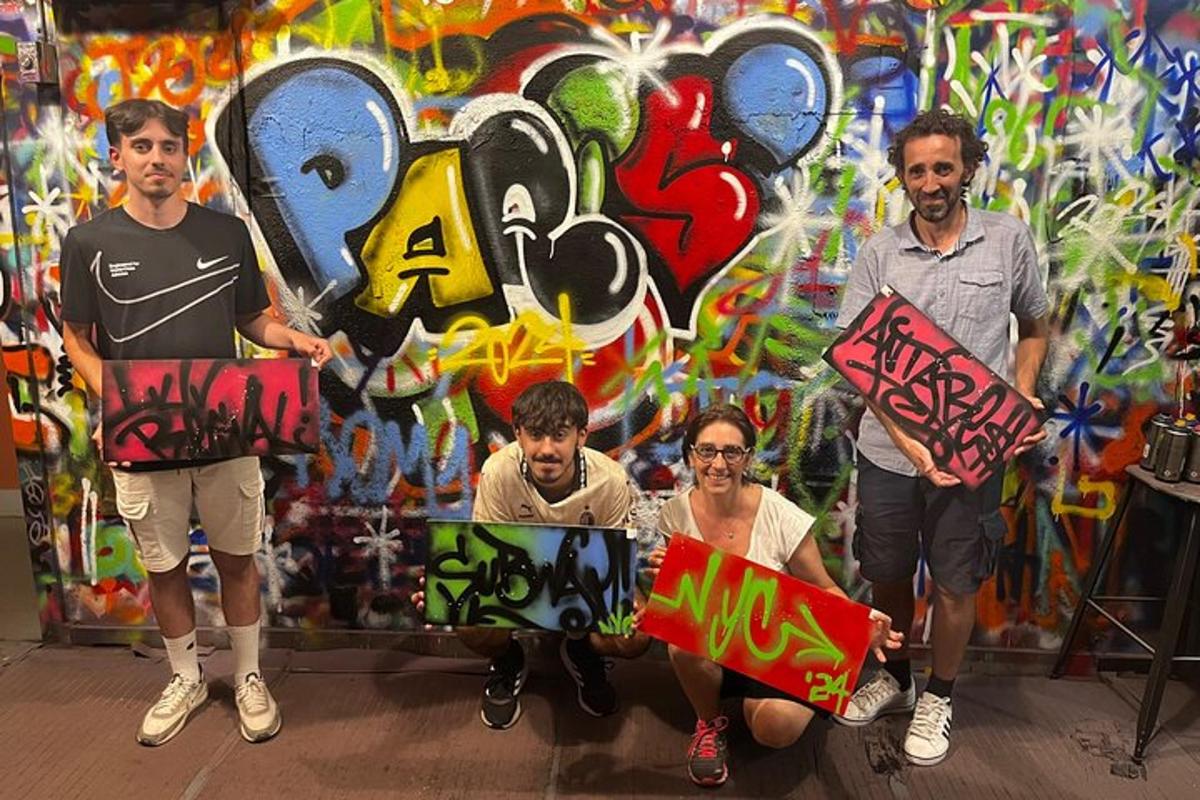 a group of men holding signs in front of a wall with graffiti