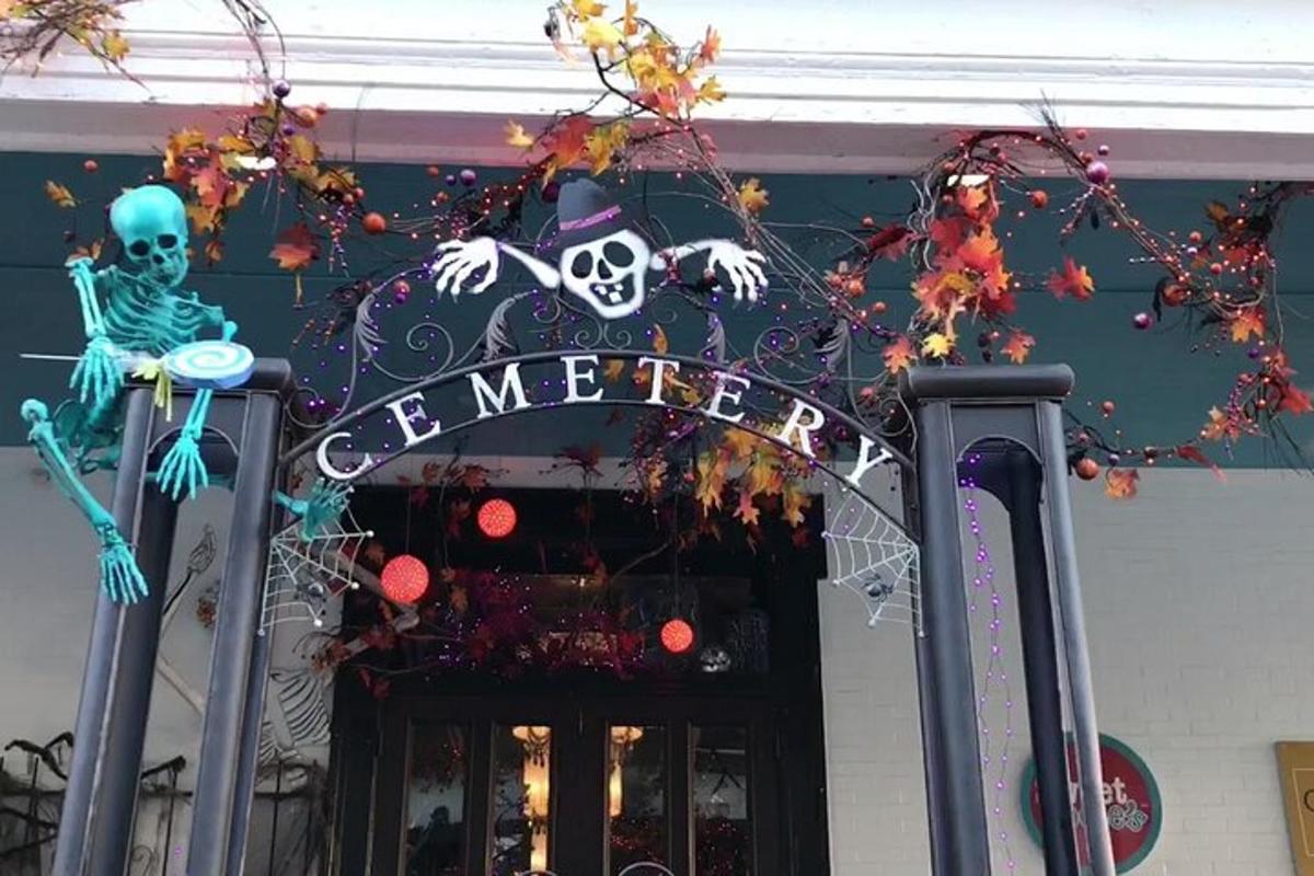 a halloween sign on the front of a store
