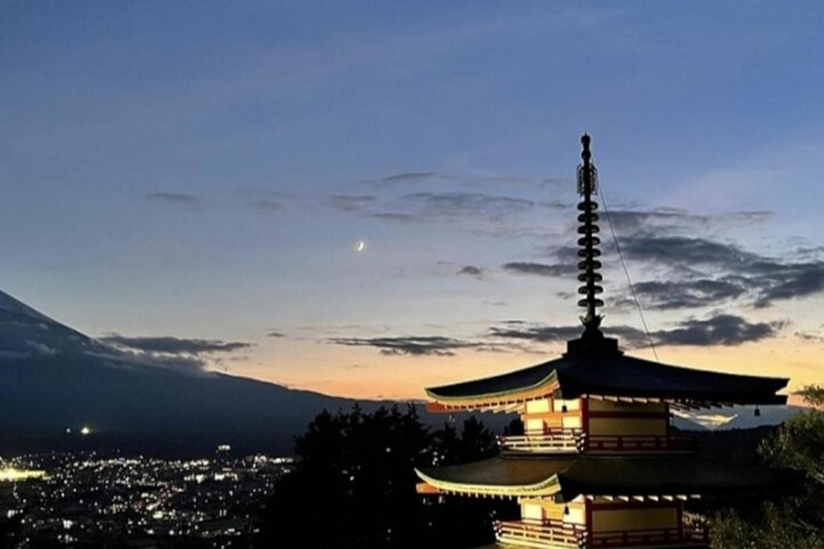a pagoda on top of a mountain at night