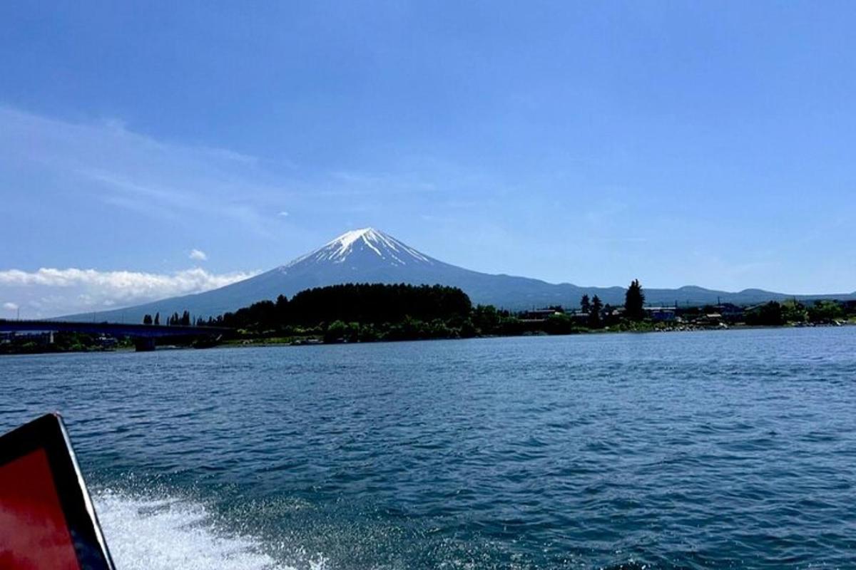 a mountain in the background of a body of water