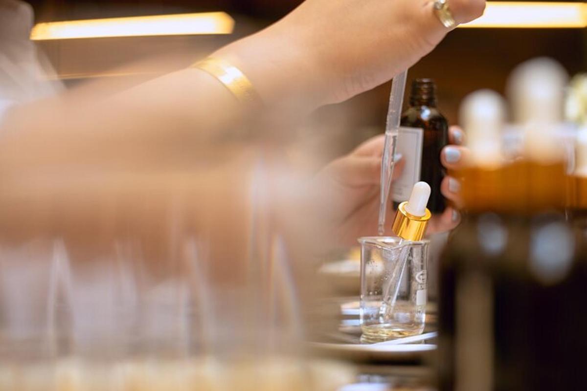 a person is holding a bottle of alcohol