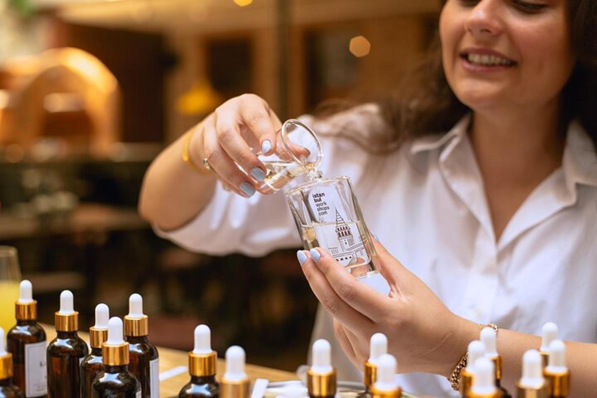 a woman holding a wine glass in front of bottles