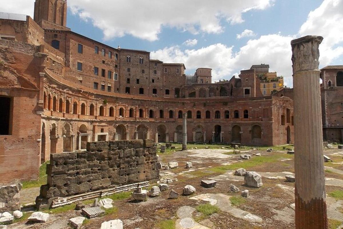 a large building with ruins in front of it