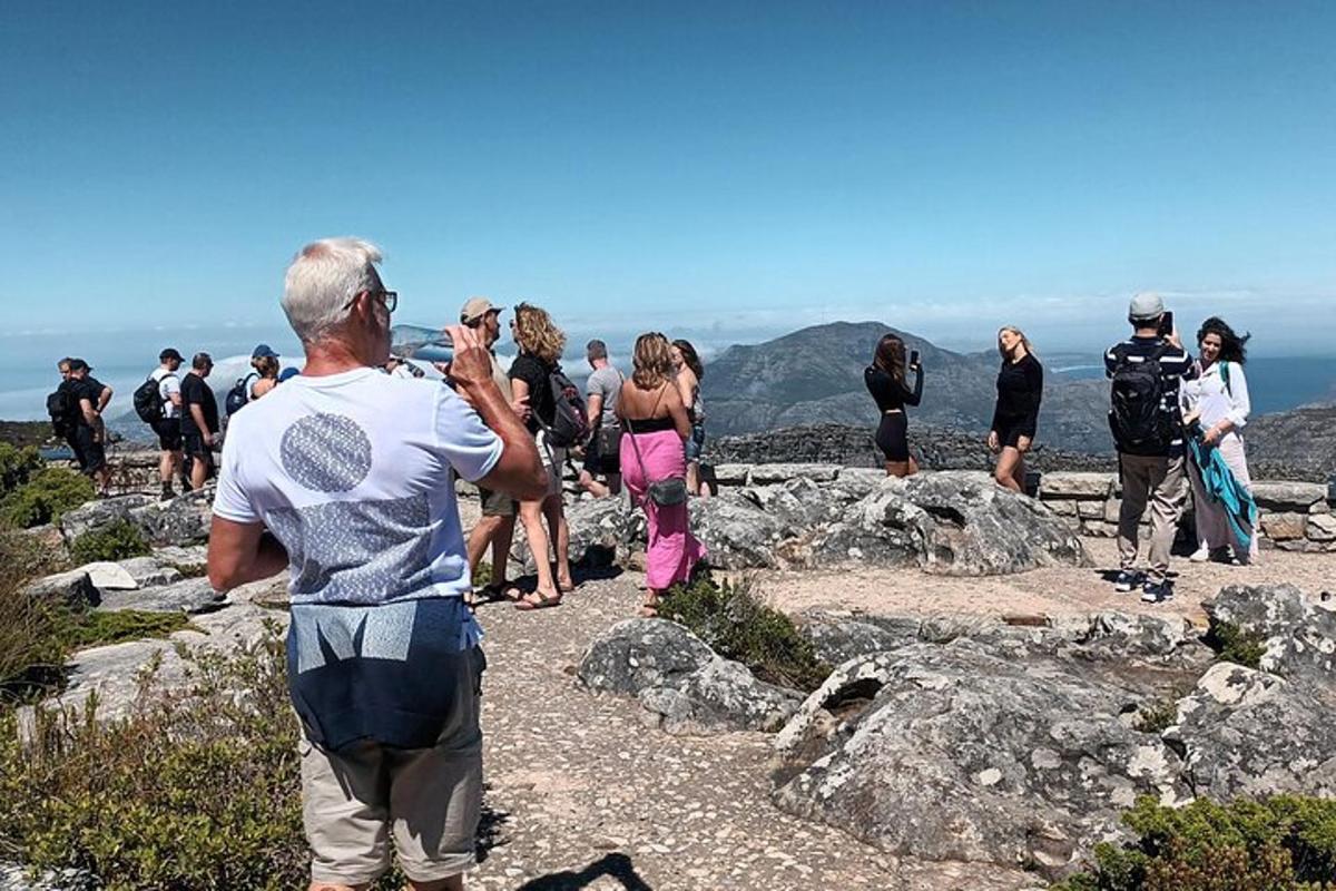a group of people standing on top of a mountain
