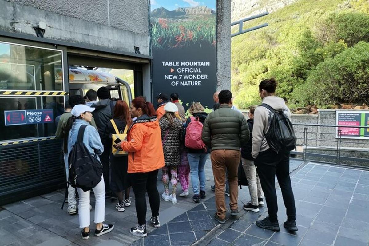a group of people waiting to get on a bus