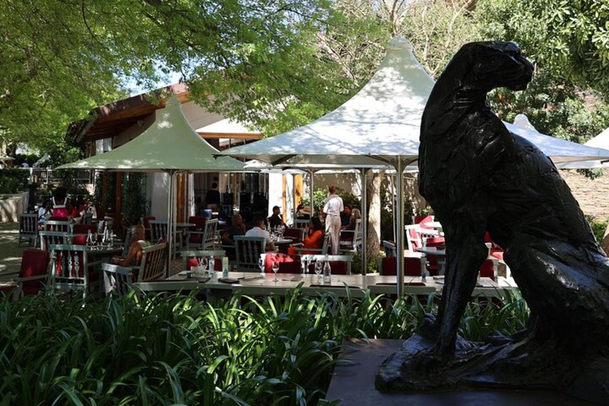 a statue of a dog in front of a restaurant