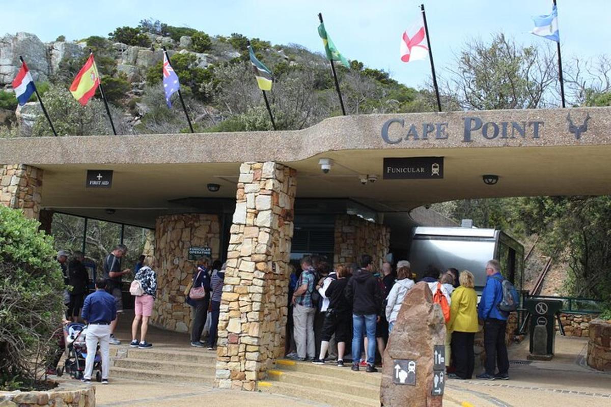 a group of people standing outside of a car park