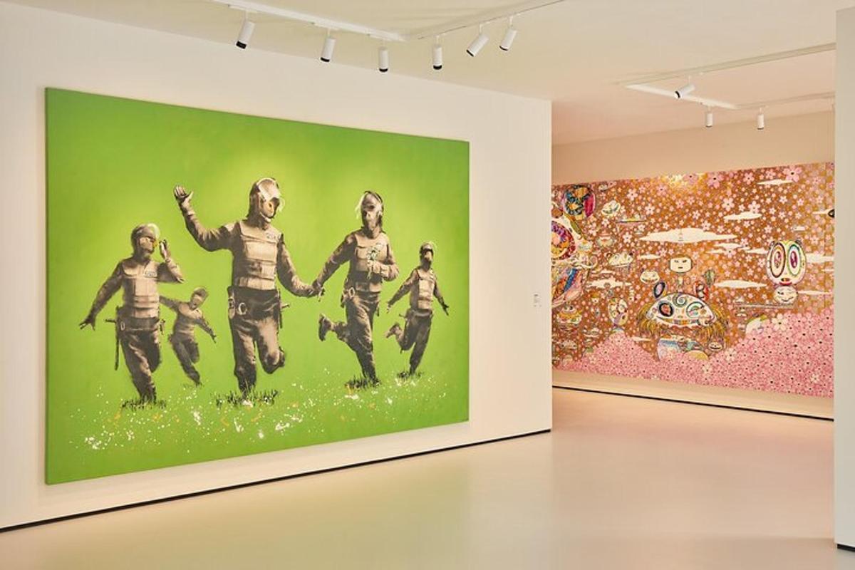 a painting of a group of people on a wall in a museum