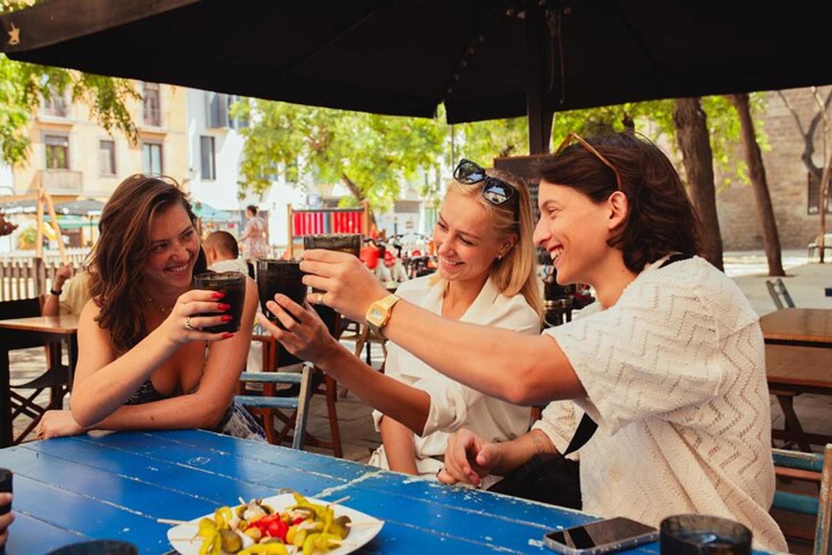 a group of women sitting at a table drinking