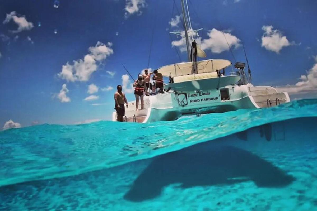 a group of people standing on a boat in the ocean