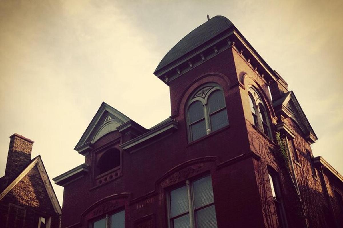 a tall brick building with a tower on top of it