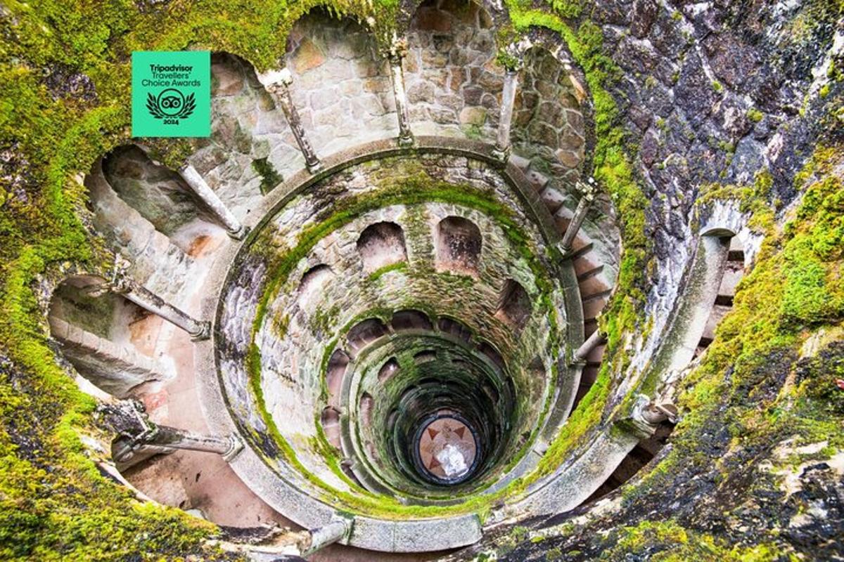 an aerial view of a spiral staircase with a green sign