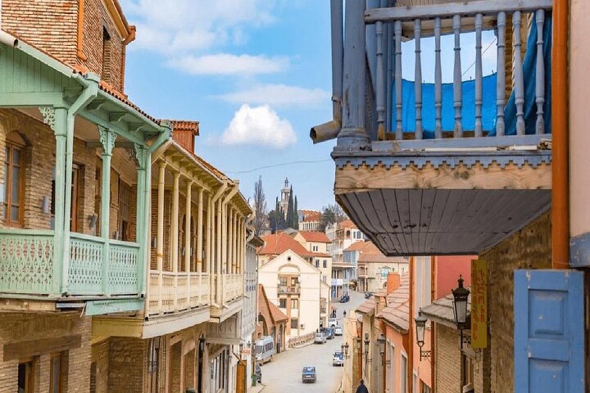 a balcony on a building on a city street